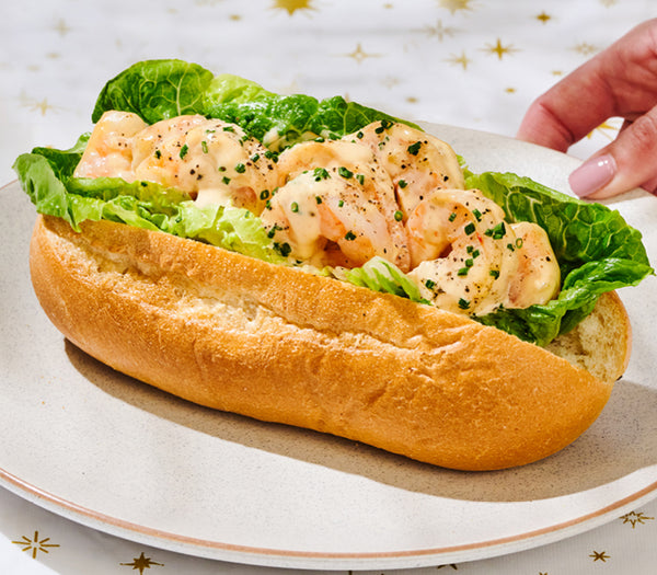 <p>A crusty baguette filled with fresh cos lettuce, prawns and cocktail sauce <br/>topped with chives.<br/>2463kJ</p>
