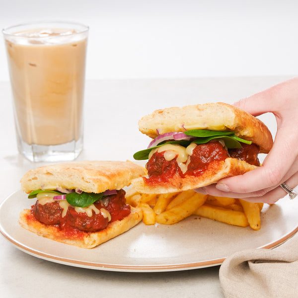 <p>Beef meatballs smothered in rich napolitana sauce & melted mozzarella, spinach & red onion in a toasted ciabatta.<br/>4753kJ<br/></p>